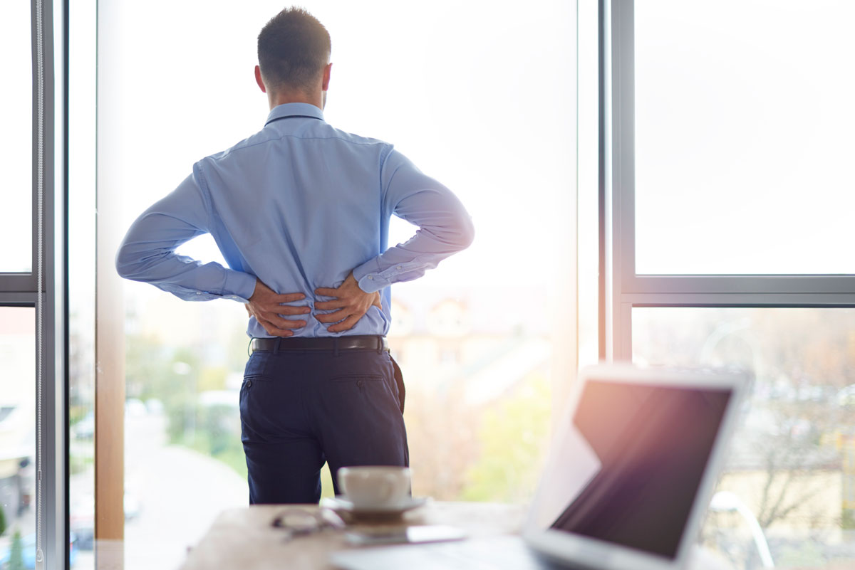 business person with back pain